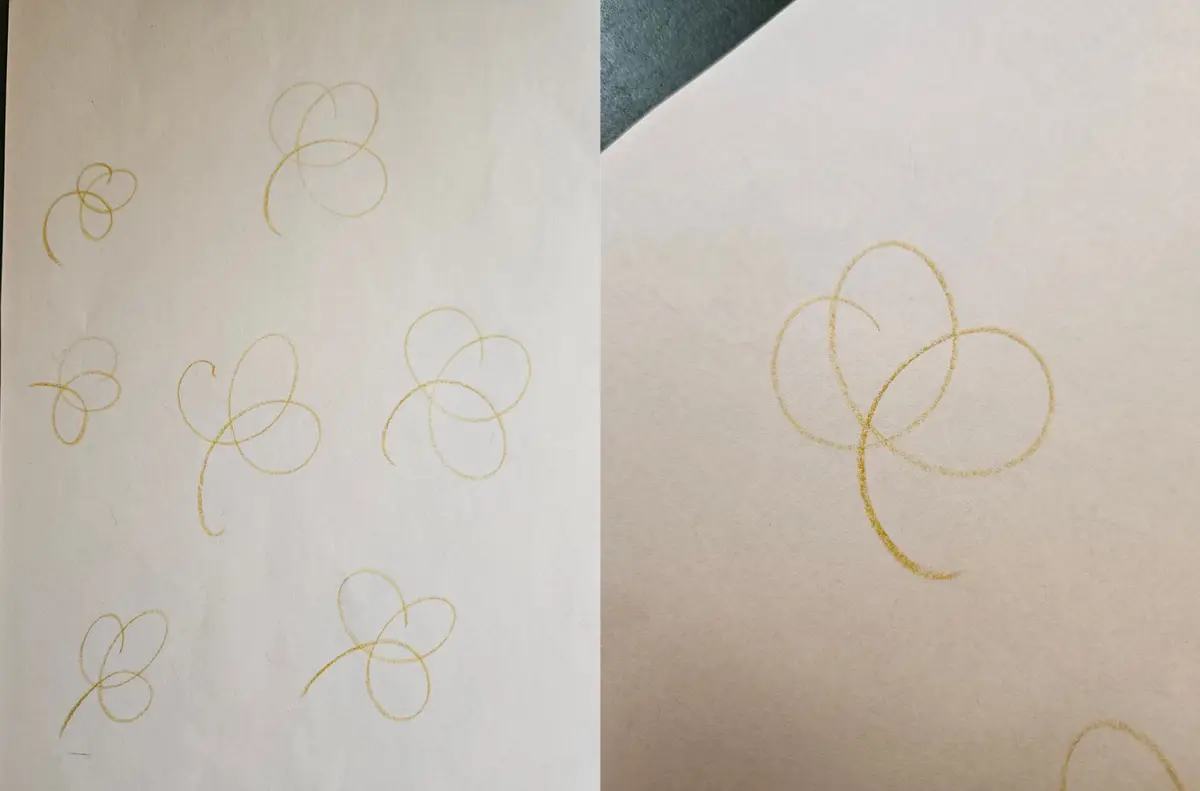 A sheet of pencil clovers drawn as loops, each a single continuous stroke, next to a larger version of the chosen one